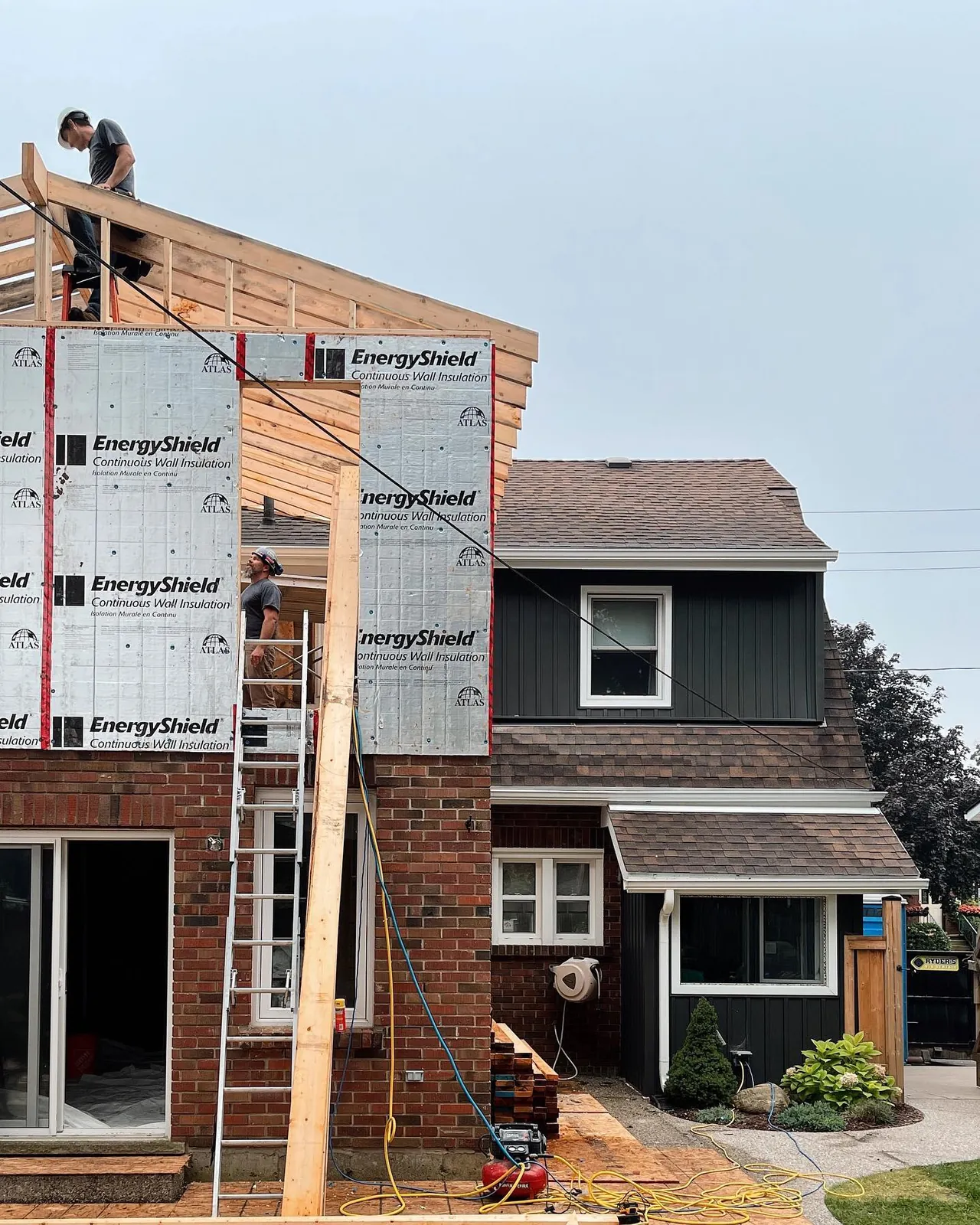 Second-storey addition in progress with continuous wall insulation in Puslinch