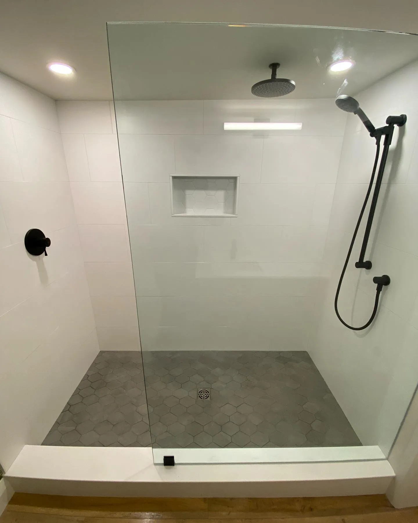 Large basement walk-in shower in Kiwanis by Caliber Contracting