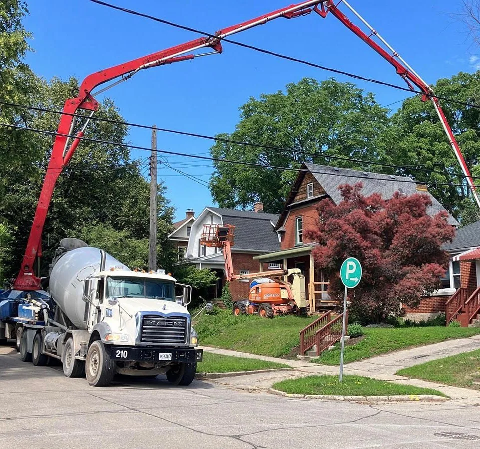 Concrete pump pouring a new foundation on a Westmount street in Kitchener