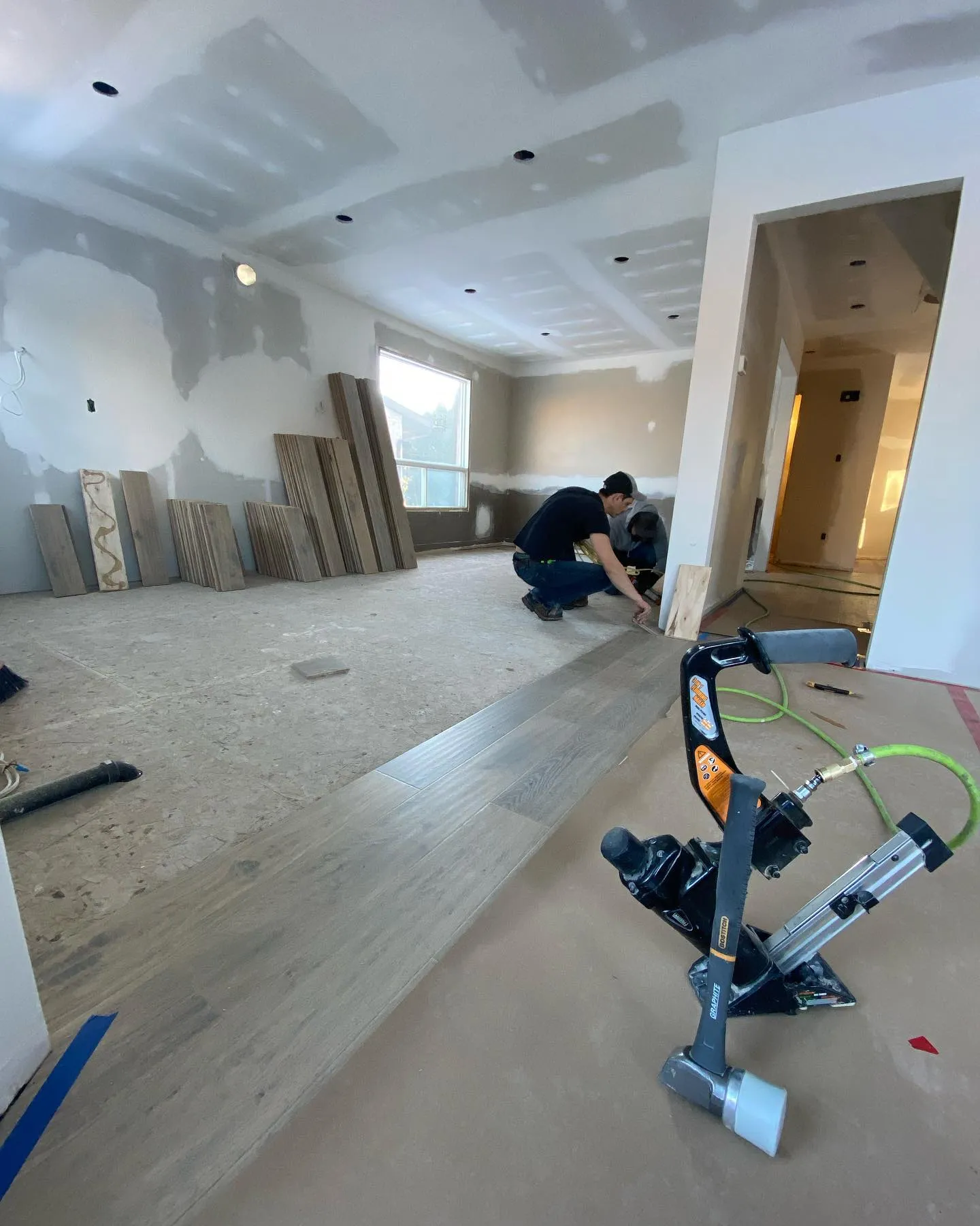 Hardwood flooring installation in whole home renovation in Waterloo by Caliber Contracting