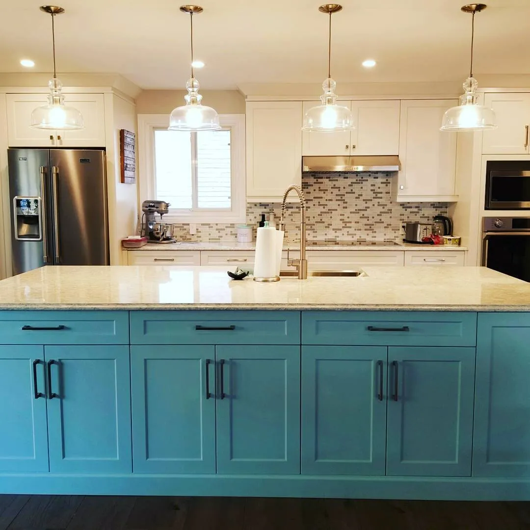 Robins egg blue island with glass pendants in Ancaster by Caliber Contracting