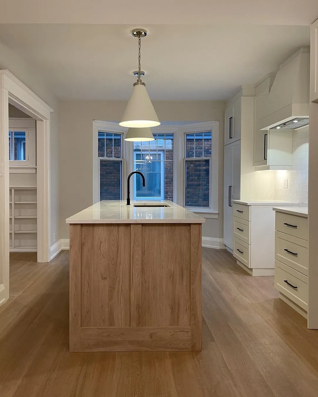 Custom white oak kitchen in Kitchener by Caliber Contracting