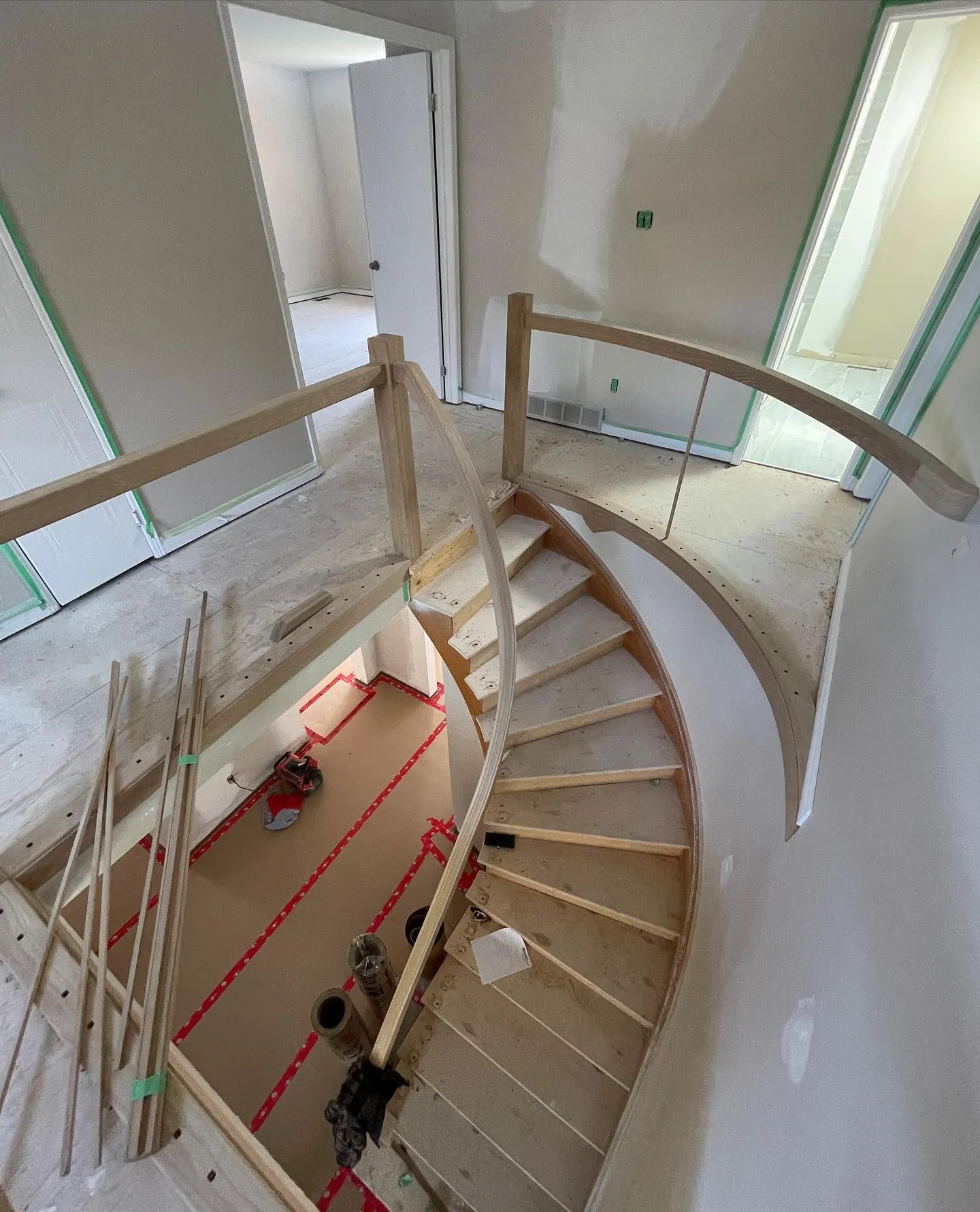 Custom curved staircase in Kiwanis Park renovation by Caliber Contracting