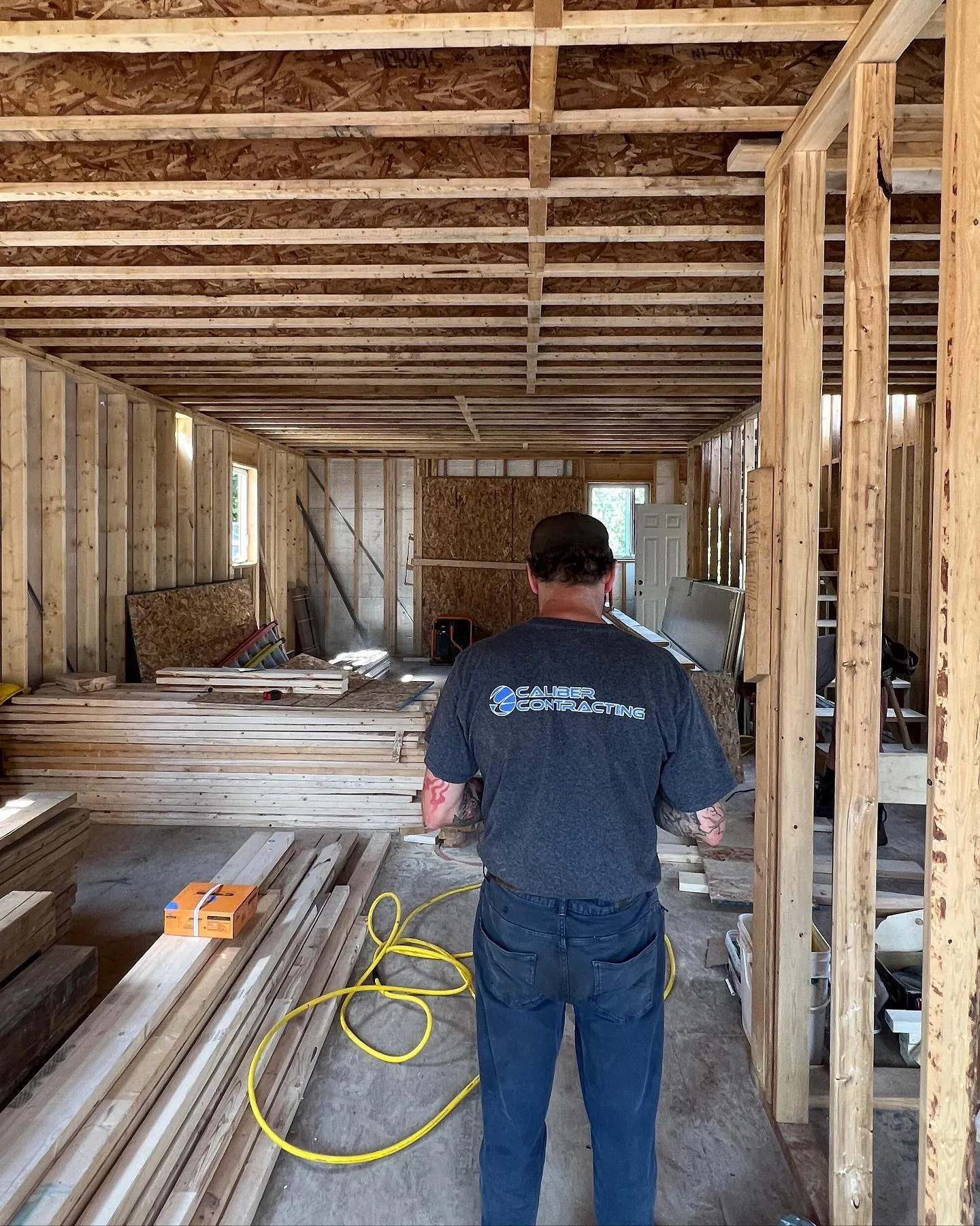 Caliber Contracting team member framing a new home in Preston