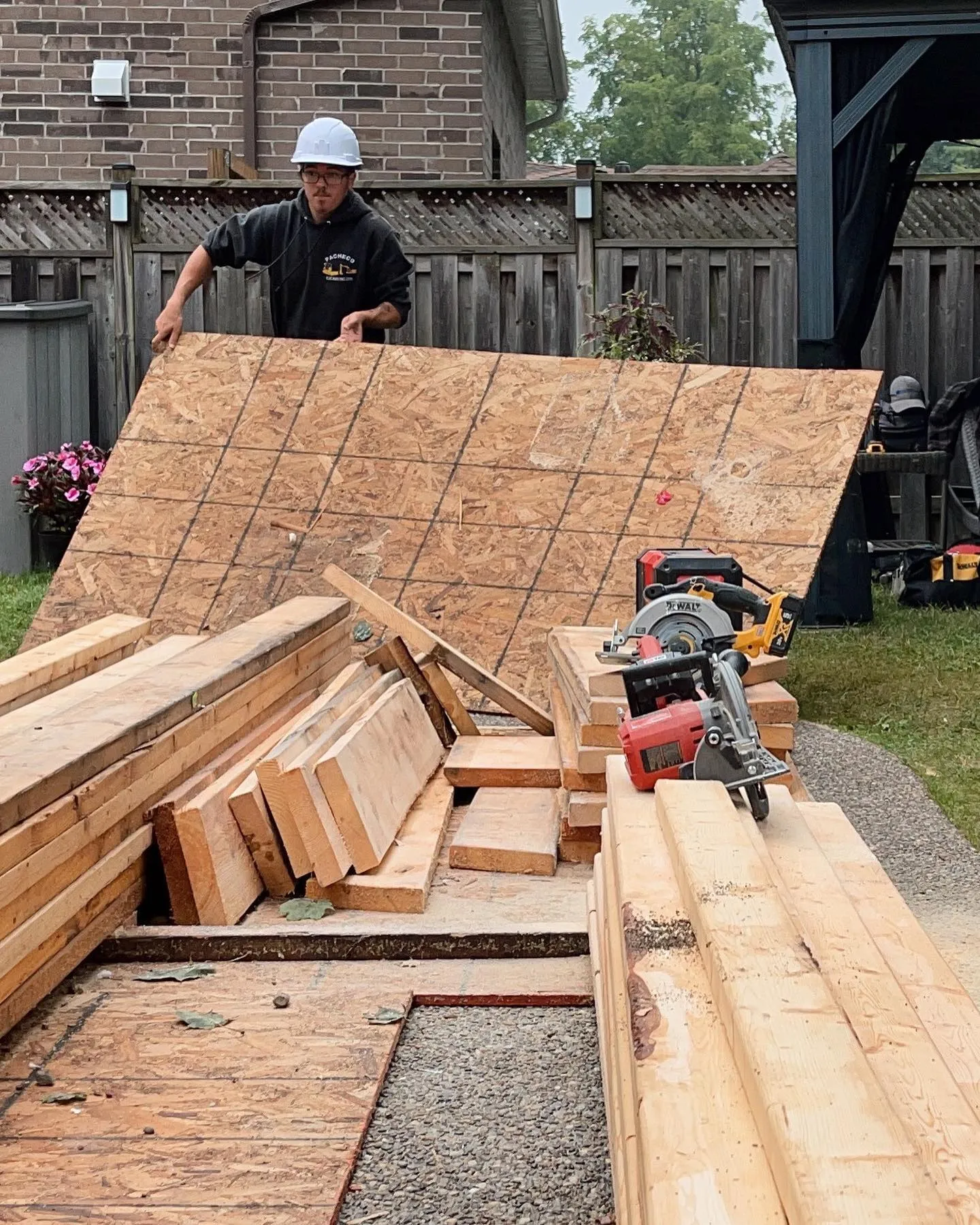 Caliber Contracting team reviewing lumber for a design build project