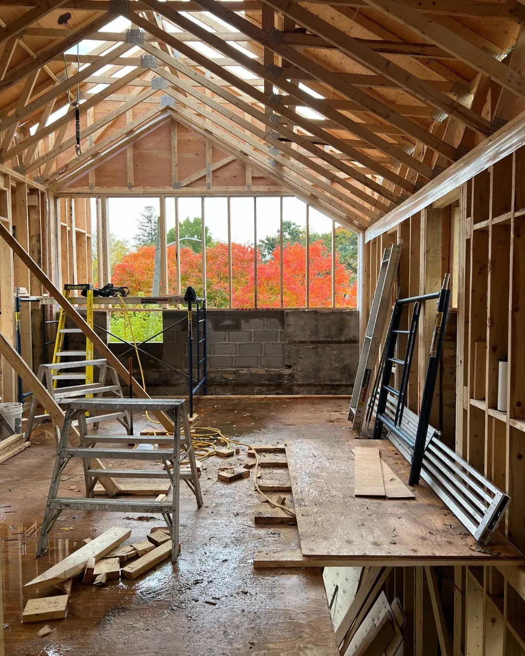 Whole home renovation framing with vaulted ceilings and fall foliage in Kitchener by Caliber Contracting